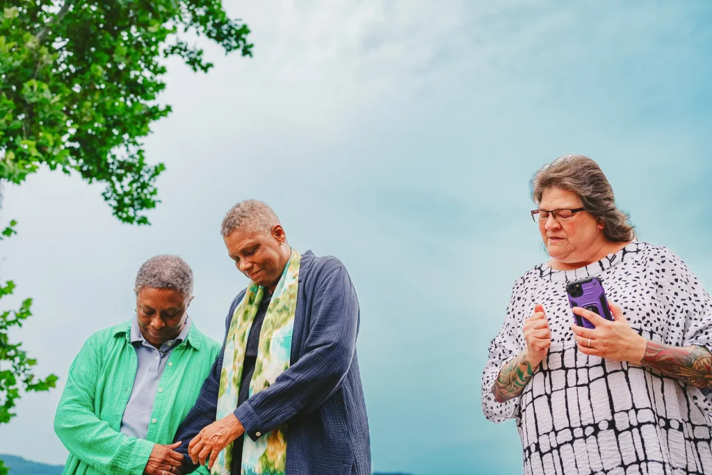 same sex couple holding hands at elopement ceremony