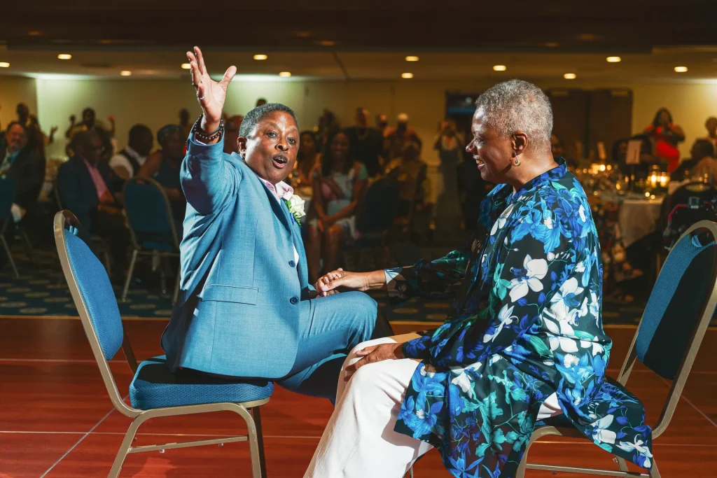 woman serenading her partner at wedding reception