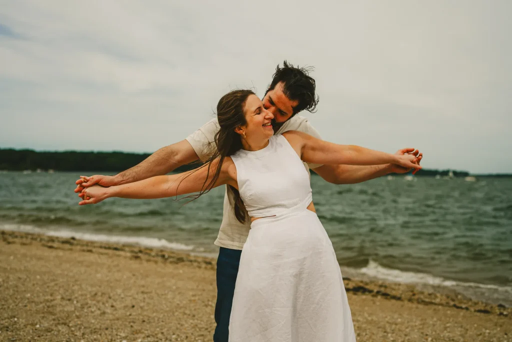 couple holding hands on beach