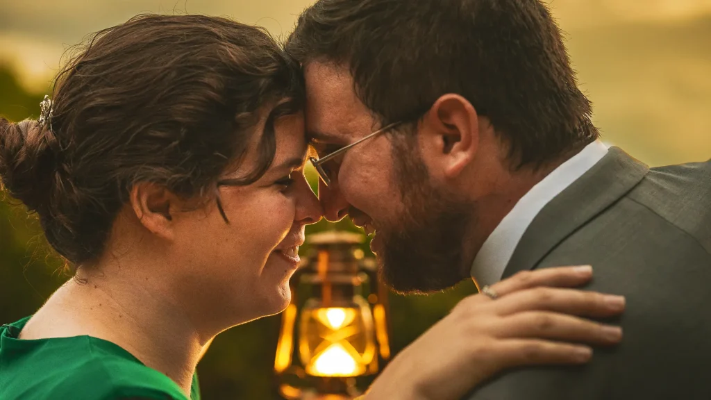 elopement couple touching heads in front of lantern