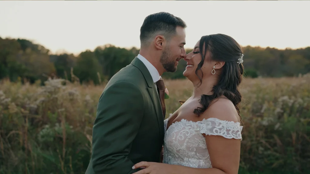Bride & groom eskimo kissing at 48 fields