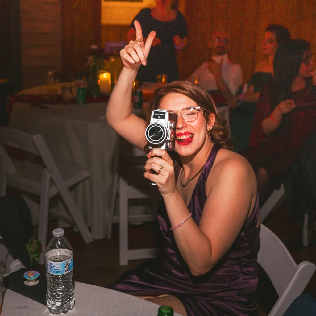 bridesmaid filming on a retro super-8 campsnap camera