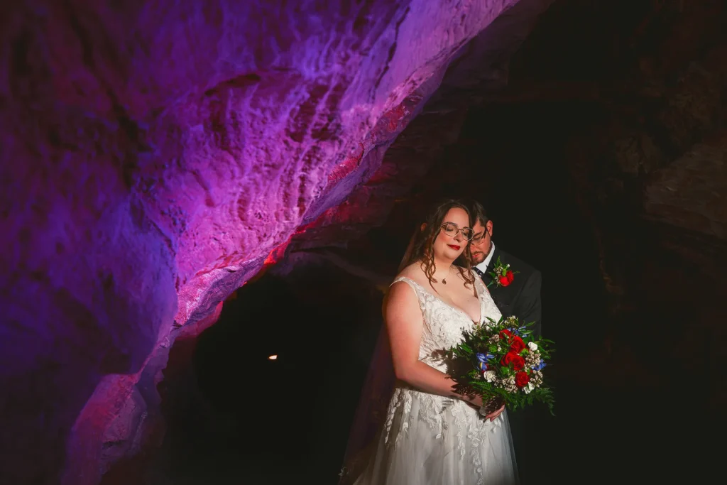 couple in shenandoah caverns with purple wall